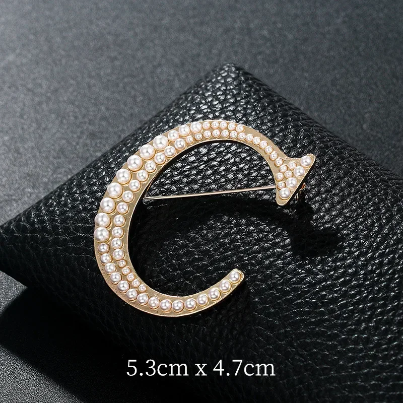 Broches de perlas A K D con le - Women Accessories In English reseña y precio